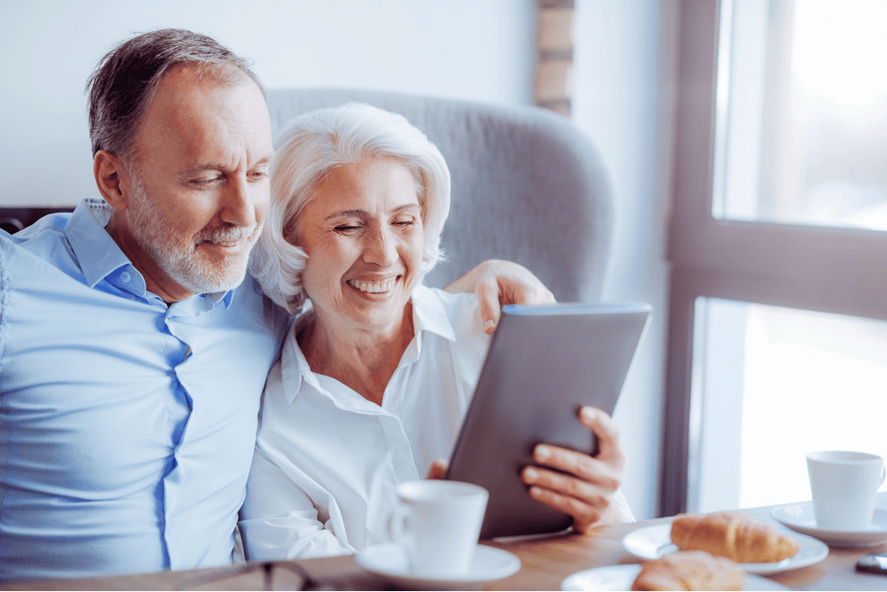 a couple in their 50s reviewing health insurance